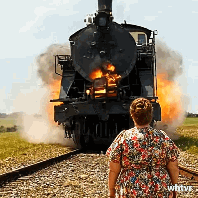 A steam engine train crashing into a fat lady. The train gets destroyed while the lady smiles